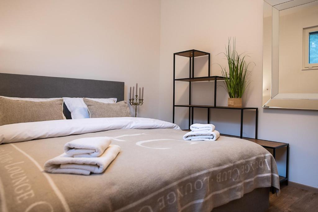 Bed detail with folded towels