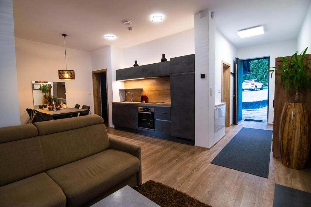 Living and kitchen area with the private entrance open onto your own parking space